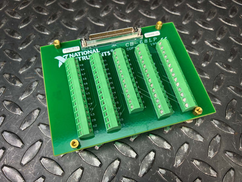 Green CB-68LP board angled on diamond plate showing five green screw terminal strips