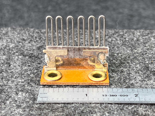Federal Pacific F2.5 Thermal Overload Heater Element, a replacement electrical component featuring six upright, Ushaped silver heating wires connected to a tarnished brasscolored metal bracket, mounted on an orangebrown insulating base with two brass eyelet terminals. The element is shown against a gray textured background with a ruler indicating its length is approximately 2 inches, useful for industrial motor protection or control panel systems.