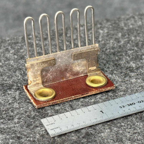 Federal Pacific F3.55 heater element at an angle, five wire loops, mica plate, brass eyelets, ruler