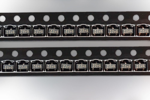 Two cut strips of Philips BZX84-C5V1 SOT-23 zener diodes in black carrier tape
