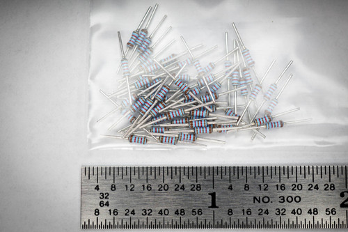 Resistors in clear plastic bag, leads appear untarnished, showing color bands brown red brown red brown. Ruler NO. 300.