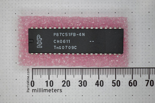NXP P87C51FB-4N 40-pin DIP microcontroller on pink anti-static bubble wrap beside ruler