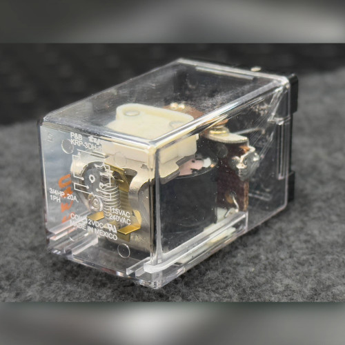 KRP-3DH-12 relay angled view showing clear case, coil, contacts and case markings