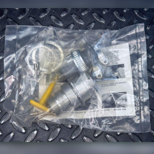 DEUTSCH HD44-18-8PN-059 connector kit in sealed poly bag, top view on diamond plate