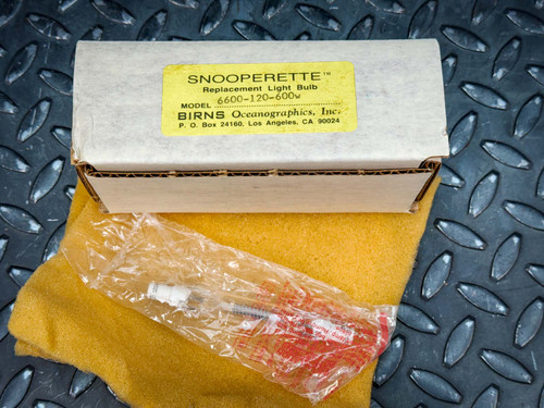 Birns Oceanographics Snooperette replacement lamp box with wrapped bulb on shop cloth