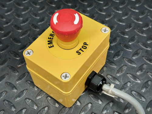 Allen-Bradley emergency stop assembly featuring a large red mushroom button on a yellow enclosure with the words 'EMERGENCY STOP' labeled on it.