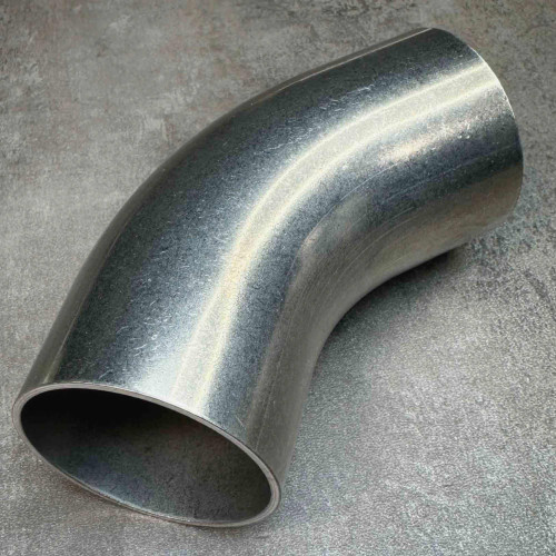 MKS 1002345WT200 stainless 45 degree buttweld elbow photographed at an angle on gray surface