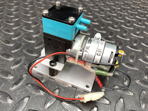 KNF FLODOS PML 1356-NF 30 diaphragm pump on aluminum mounting plate, angled view with leads
