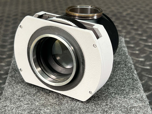Zeiss Tessovar 47 60 10-9901 cine adapter, three-quarter view, white shutter housing and brass top port