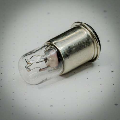 Close-up of a Sylvania 382 Miniature Lamp with T1.75 SX6S base from PartsMine.com, showing the clear glass bulb attached to a metallic cylindrical base.