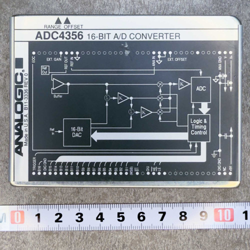 Top view of the Analogic ADC4356 16-Bit A/D Converter Module from PartsMine.com, showing labeled circuit diagram and pin layout with a ruler for scale.