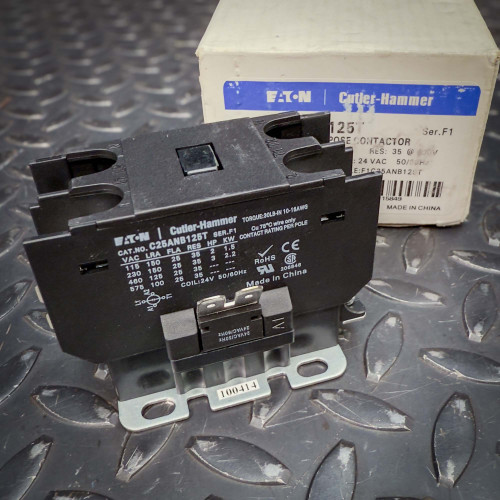 Eaton Cutler-Hammer C25ANB125T definite purpose contactor from PartsMine.com shown angled on a metal surface, with its labeled box in the background.