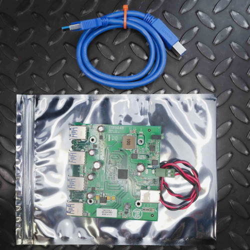 Used IOI U3H414B USB 3.0 hub board in anti-static bag beside coiled blue USB cable