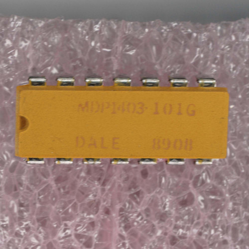 MDP1403-101G DALE 8908 visible on orange DIP package. Leads clean, straight, no corrosion. Pin 1 dot visible.