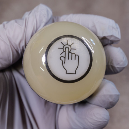 Banner capacitive touch button dome showing clear touch symbol no visible scratches or defects.