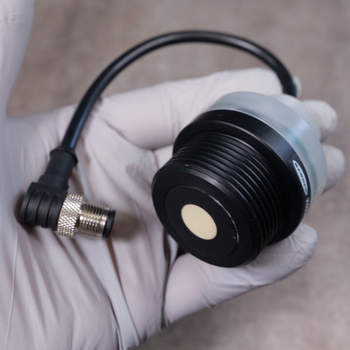 Banner ultrasonic sensor showing clean housing, intact M12 5-pin connector, and no visible damage or wear.