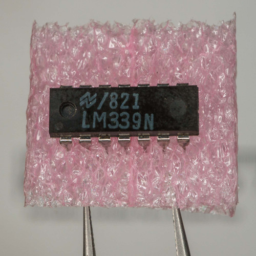 National Semiconductor logo 821 LM339N printed on black IC body, pins appear clean and straight.