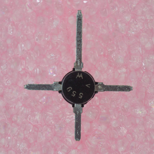 Motorola logo and date code "V 5G" legible on black epoxy top; four leads show light oxidation, shown on pink anti-static foam.