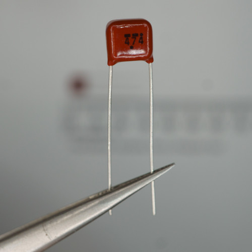 Red epoxy body marked "474," both leads straight and unsoldered, body intact with no chips or cracks visible.