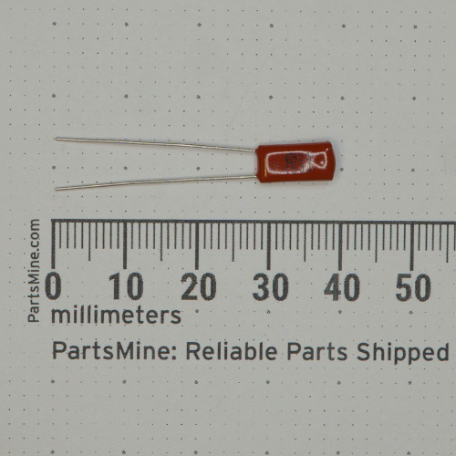 Rust-red epoxy body approximately 7mm long; both radial leads straight and unclipped at ~28mm. Body markings partially legible; circled S visible.