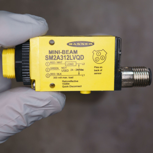 Yellow housing clean with no visible scratches. Label reads SM2A312LVQD, 24–240Vac, 300 mA max load. Quick-disconnect connector present.