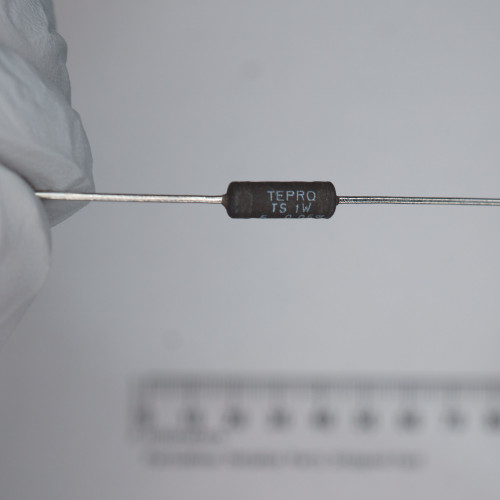 Black axial-leaded body marked TEPRO, TS 1W, and partial code readable as 5 0.05%. Straight tinned leads, no visible damage.