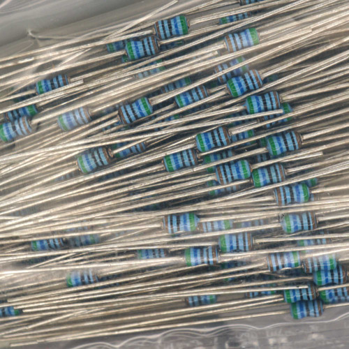 Axial-leaded resistors with blue body and green end caps, 5-band color code visible: green, blue, black, black, brown. Leads unbent and bright.