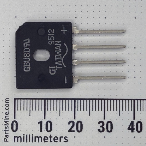 Flat black molded package, four straight leads with + and - polarity marks visible. Stamped codes: GBU8D, GT TAIWAN, 9512.
