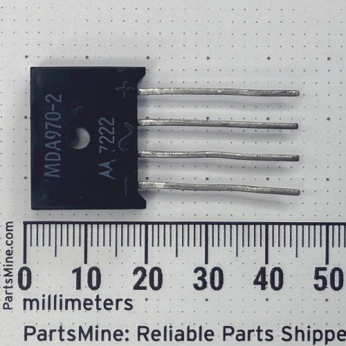 Flat-pack body marked MDA970-2 and AA 7222 with pin polarity symbols. Four leads show slight bends and age tarnish.