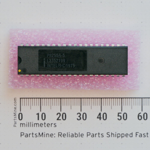 Top view of Intel P8255A-5 integrated circuit on foam next to a metric ruler.
