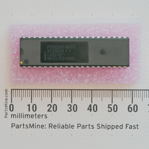 Top view of Intel P8052AH-BASIC 40-pin DIP chip on pink foam with a metric ruler.