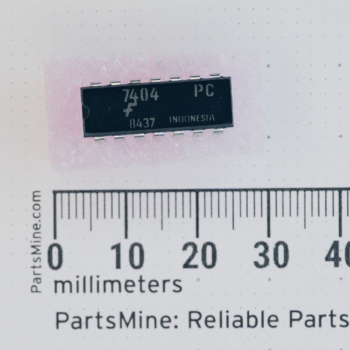 Fairchild 7404PC 14-pin DIP IC shown with a millimeter ruler.