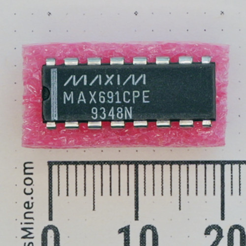 Top view of MAXIM MAX691CPE IC in 16-pin DIP package on foam.
