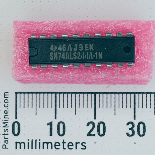 Texas Instruments SN74ALS244A-1N DIP-20 IC on pink foam next to a metric ruler.