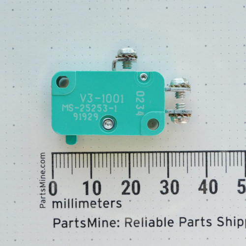 MICRO SWITCH V3-1001 switch on a millimeter scale.