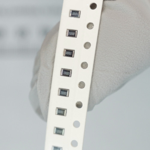 Vishay surface mount resistors marked 1000 in tape carrier.