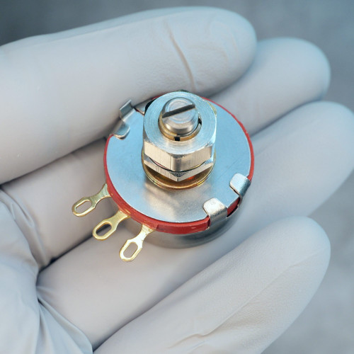 Top angle view of PEC RV4LAYSA102A K4 potentiometer showing slotted shaft, hex nut, and solder terminals.