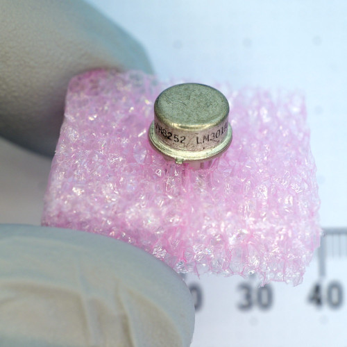 Side view of National Semiconductor LM301AH metal can package showing part markings.