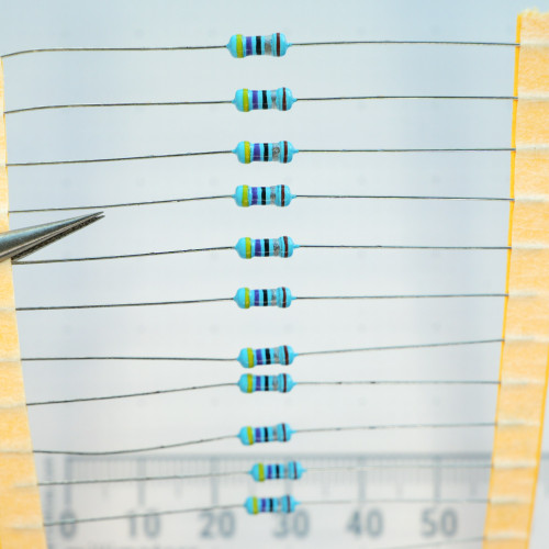 Cut tape strip of unbranded 4.7.25W-R 4.7 ohm axial-lead resistors.