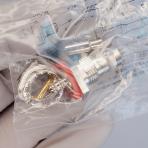 Amphenol RFX 31-318-RFX RF connector components including threaded body, red O-ring, and gold contact pin in bag.