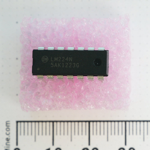 ON Semiconductor LM224N 14-pin DIP integrated circuit on pink protective material.