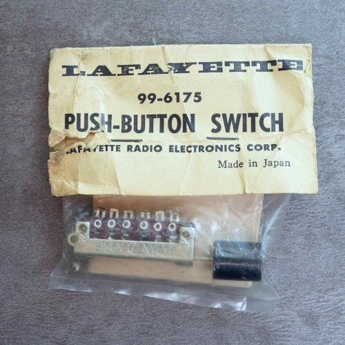 Lafayette 99-6175 push button switch sealed in original packaging with header card.