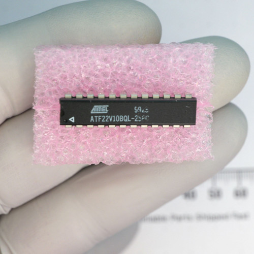 Top view of Atmel ATF22V10BQL-25PC DIP-24 IC on pink ESD foam.