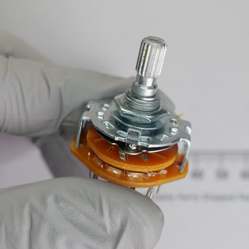 Angled view of Jameco G3SR022-R rotary switch showing shaft, mounting nut, and wafer assembly.