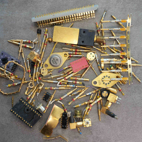 Overview of approximately 140 grams of gold-plated electronic scrap components and connectors.