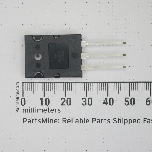 Top view of ON Semiconductor MJL21194 power transistor with millimeter ruler.