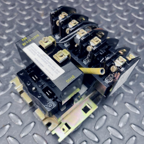 Square D HDO-40 control relay showing coil assembly, contact blocks, and metal mounting base.