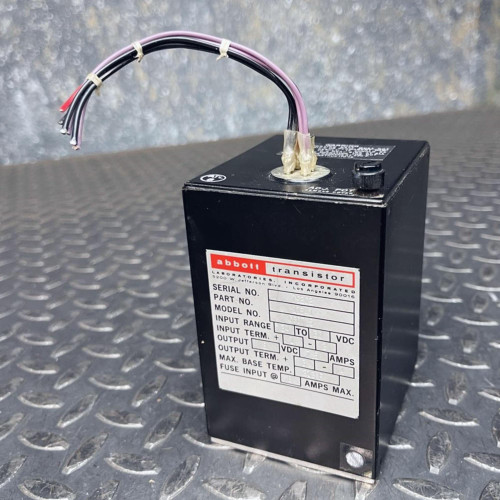 Abbott C8D7.5 power supply module showing top wire leads and side specification label.