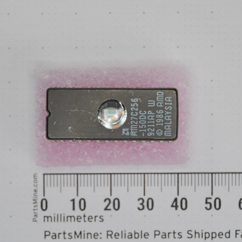 Top view with millimeter scale of AMD AM27C256-150DC UV EPROM in ceramic DIP package.