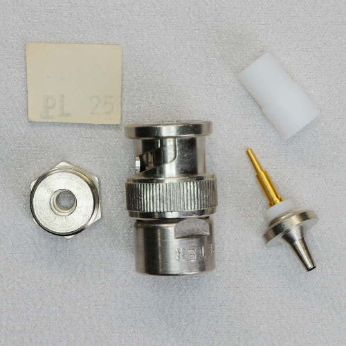 Disassembled components and vintage 'PL 25' label for Trompeter PL25 connector.